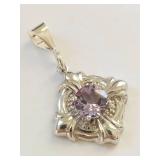 925 sterling silver pendant with faceted purple stone ornate floral setting