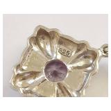 925 sterling silver pendant with faceted purple stone ornate floral setting