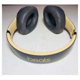 BEATS Wireless Studio3 Noise Cancelling headphones grey & tan in color.