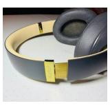 BEATS Wireless Studio3 Noise Cancelling headphones grey & tan in color.