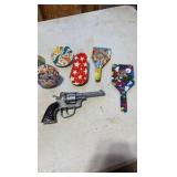 VINTAGE tin litho toy noise makers; mid-century Eagle cap gun