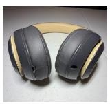 BEATS Wireless Studio3 Noise Cancelling headphones grey & tan in color.