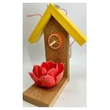 Decorative Birdhouse & Floral Arrangement On Vintage Stack Of Drawers