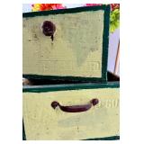 Decorative Birdhouse & Floral Arrangement On Vintage Stack Of Drawers