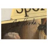 John Wooden Autographed Newspaper Article, Laminated