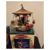 Holiday in Motion Revolving Lodge & Holiday Fair Carousel Holiday in Motion Revolving Lodge & Holiday Fair Carousel