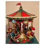 Holiday in Motion Revolving Lodge & Holiday Fair Carousel Holiday in Motion Revolving Lodge & Holiday Fair Carousel
