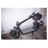 NEW Electric Scooter. w/lock & charger, extra inner tube for tire. 12' tires