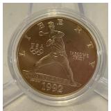 1992 D-Olympic Baseball Commemorative Uncirculated Silver Dollar - just the coin in a protective plastic case, one appears to have slight fire damage