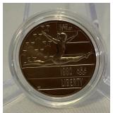1992 P-Olympic Gymnastics Commemorative Clad Uncirculated Half Dollar - just the coin in a protective plastic case