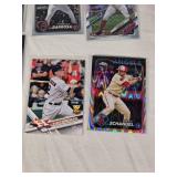 Lot of 14 Baseball Rookie Cards Featuring Adley Rutschman, Evan Carter, and Colton Cowser. Includes various brands with special features like holographic and holiday designs. Lot of 14 Baseball Rookie Cards Featuring Adley Rutschman, Evan Carter, and Colton Cowser. Includes various brands with special features like holographic and holiday designs.