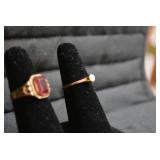 Ladies rings, one with red stone is... Ladies rings, one with red stone is...