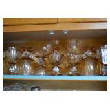 Stemware, various sizes. Light ambe... Stemware, various sizes. Light ambe...