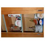 Christmas dishes in both cupboards... Christmas dishes in both cupboards...