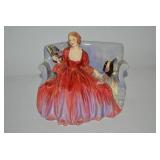 Royal Doulton porcelain seated lady... Royal Doulton porcelain seated lady...