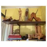 Wood carvings and books, all on 2 s... Wood carvings and books, all on 2 s...
