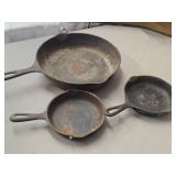 Lot of (3) Cast Iron Pans 11' (x1), 6-1/2' (x2) Lot of (3) Cast Iron Pans 11' (x1), 6-1/2' (x2)
