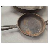 Lot of (3) Cast Iron Pans 11' (x1), 6-1/2' (x2) Lot of (3) Cast Iron Pans 11' (x1), 6-1/2' (x2)