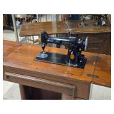 Singer Sewing Machine with Wood Flip-Top Cabinet 58' x 17' x 38' Singer Sewing Machine with Wood Flip-Top Cabinet 58' x 17' x 38'