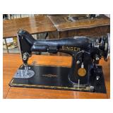 Singer Sewing Machine with Wood Flip-Top Cabinet 58' x 17' x 38' Singer Sewing Machine with Wood Flip-Top Cabinet 58' x 17' x 38'