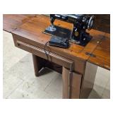 Singer Sewing Machine with Wood Flip-Top Cabinet 58' x 17' x 38' Singer Sewing Machine with Wood Flip-Top Cabinet 58' x 17' x 38'