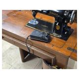 Singer Sewing Machine with Wood Flip-Top Cabinet 58' x 17' x 38' Singer Sewing Machine with Wood Flip-Top Cabinet 58' x 17' x 38'