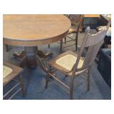 Vintage Clawfoot Wood Dining Table with (4) Wicker Seat Side Chairs Vintage Clawfoot Wood Dining Table with (4) Wicker Seat Side Chairs