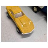 Vintage 1970's Tonka Pressed Steel Toy Car Carrier with Yellow and Red Corvette Cars Vintage 1970's Tonka Pressed Steel Toy Car Carrier with Yellow and Red Corvette Cars