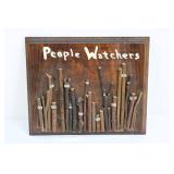 People Watchers Wood Wall Plaque with Twig Figures & Googly Eyes 11' x 9'