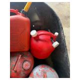 Lot of various gas cans including bucket.