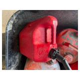 Lot of various gas cans including bucket.