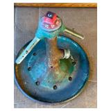 Vintage Rain King lawn sprinkler from the 1920s through the 1950s, manufactured by the Chicago Flexible Shaft Company.