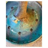 Vintage Rain King lawn sprinkler from the 1920s through the 1950s, manufactured by the Chicago Flexible Shaft Company.