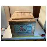Vintage wooden storage box with contents inside