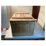 Vintage wooden storage box with contents inside