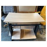 Rolling desk with two office chairs