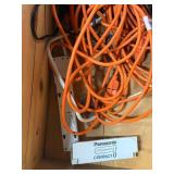 Wood box with electrical cords, battery tender and power strip.