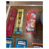 5 Gallon job site bib and various hooks and tools.