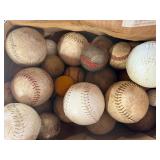 Lot of various balls , softball, croquet , baseball, golf