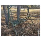 metal patio swing in green , in decent shape
