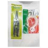 Vintage Duracell Spotlight Lantern, Can Crusher, Car Top Ladder Carrier, Pruning Shears (new), Holiday Light Hooks (new)