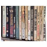 Box of Western Novels including Mack Bolan, Max Brand, and Elmer Kelton Books