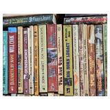 Box of Western Novels including Mack Bolan, Max Brand, and Elmer Kelton Books
