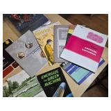 Collection of Farm and Equipment Manuals and Brochures including International Harvester Shop Manual and Husqvarna Chainsaw Manual