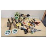 Various Garden Tools and Accessories including Trimmer Line, Shears, and Garden Hose