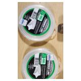 Various Garden Tools and Accessories including Trimmer Line, Shears, and Garden Hose