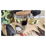Various Garden Tools and Accessories including Trimmer Line, Shears, and Garden Hose