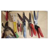 Various Garden Tools and Accessories including Trimmer Line, Shears, and Garden Hose