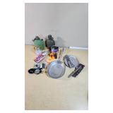 Camping and Survival Gear with Canteens, Compass, Matches, and Cookware