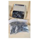 Gun cleaning supplies including Ballistol, Break-Free CLP, rods, and patches, plus assorted hardware pieces and tools